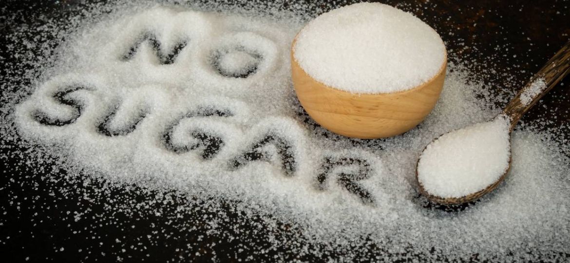 no-sugar-benefits-of-cutting-down-sugar-intake-sugar-in-a-spoon_1240x